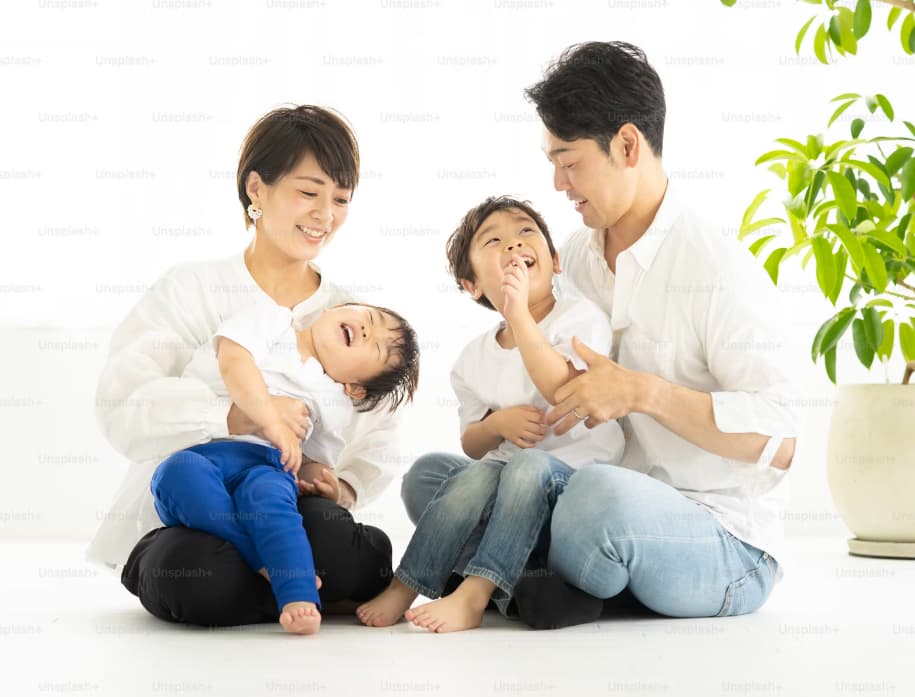 Parents Kissing Baby