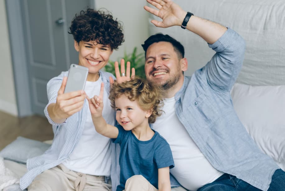 Parents Kissing Baby